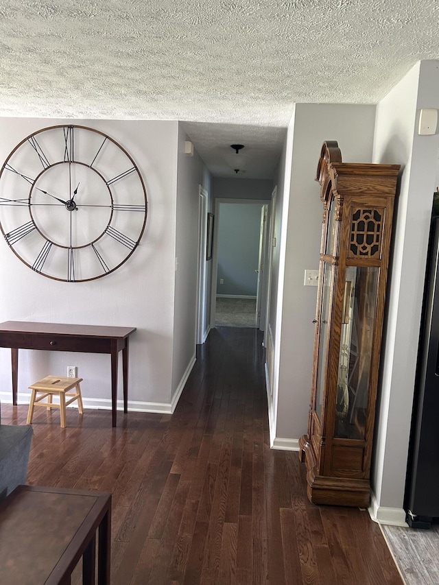 609 Clintonville Rd, Winchester, KY 40391 - hallway featuring hardwood / wood-style flooring, a textured ceiling, and baseboards