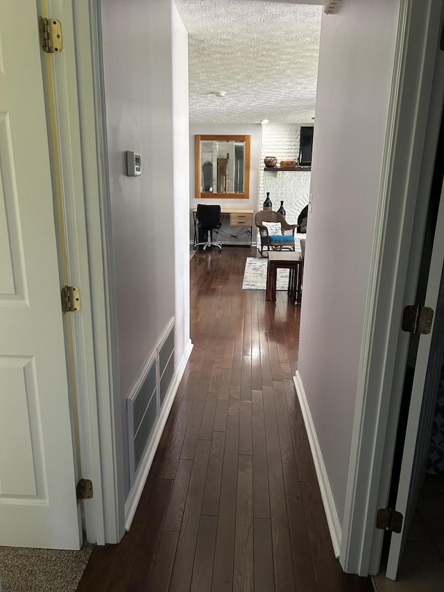 609 Clintonville Rd, Winchester, KY 40391 - hallway with a textured ceiling and dark wood-style flooring