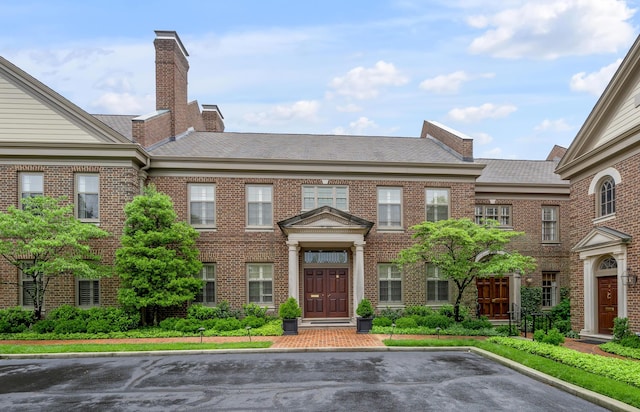 100 Idle Hour Dr Unit 8, Lexington, KY 40502 - view of front facade with brick siding and uncovered parking