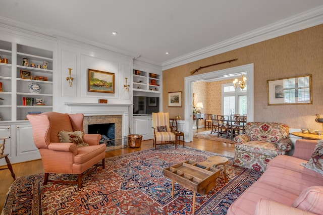 100 Idle Hour Dr Unit 8, Lexington, KY 40502 - living area featuring light wood finished floors, crown molding, wallpapered walls, and a fireplace with flush hearth