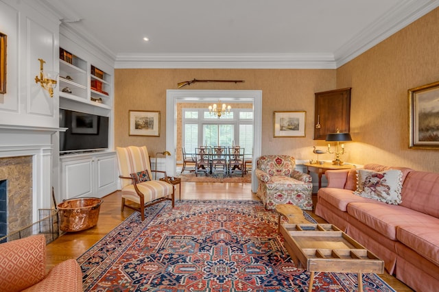 100 Idle Hour Dr Unit 8, Lexington, KY 40502 - living area featuring ornamental molding, a chandelier, wood finished floors, wallpapered walls, and a high end fireplace