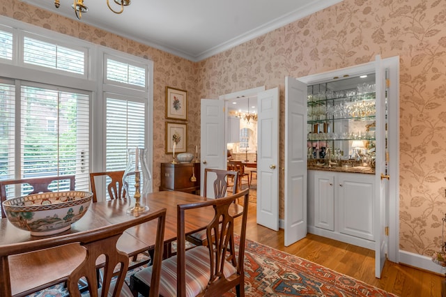 100 Idle Hour Dr Unit 8, Lexington, KY 40502 - dining space featuring light wood-style flooring, ornamental molding, and wallpapered walls