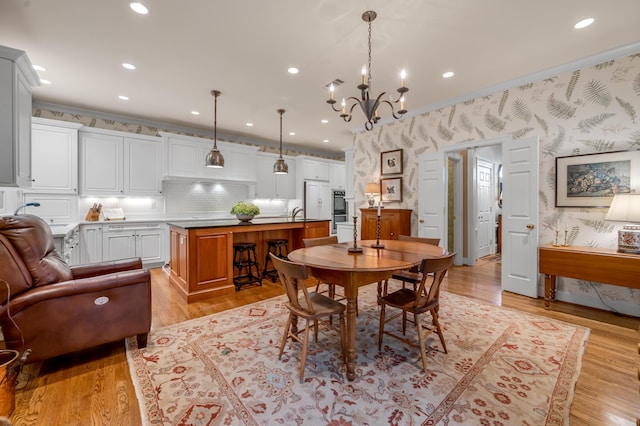 100 Idle Hour Dr Unit 8, Lexington, KY 40502 - dining area with wallpapered walls, a chandelier, light wood-style flooring, recessed lighting, and crown molding