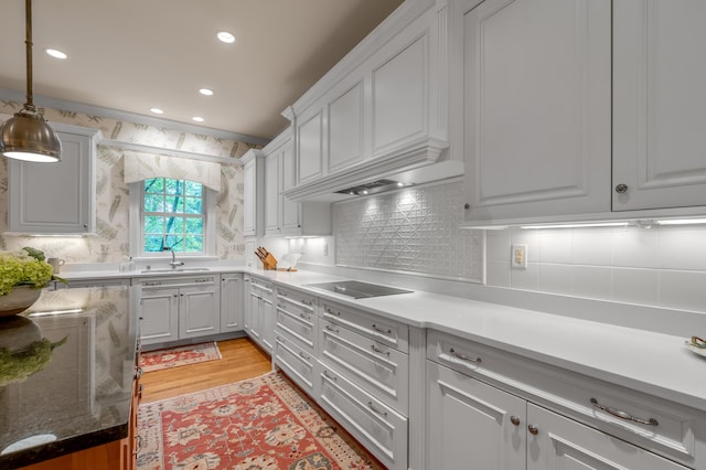 100 Idle Hour Dr Unit 8, Lexington, KY 40502 - kitchen featuring black electric stovetop, white cabinetry, light wood-style flooring, decorative backsplash, and recessed lighting