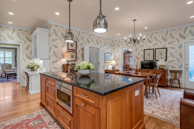 100 Idle Hour Dr Unit 8, Lexington, KY 40502 - kitchen featuring wallpapered walls, open floor plan, stainless steel microwave, light wood-type flooring, and recessed lighting