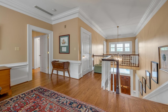 100 Idle Hour Dr Unit 8, Lexington, KY 40502 - corridor with an upstairs landing, wood finished floors, crown molding, wainscoting, and a chandelier