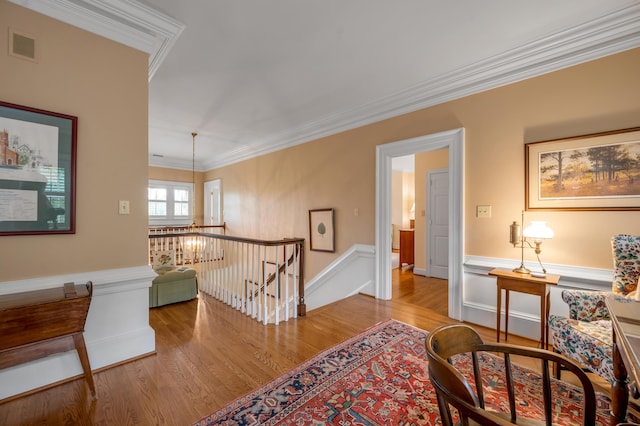 100 Idle Hour Dr Unit 8, Lexington, KY 40502 - sitting room with an upstairs landing, wood finished floors, ornamental molding, and a wainscoted wall