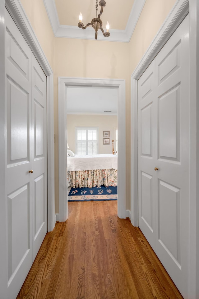 100 Idle Hour Dr Unit 8, Lexington, KY 40502 - hall featuring crown molding, a chandelier, and wood finished floors