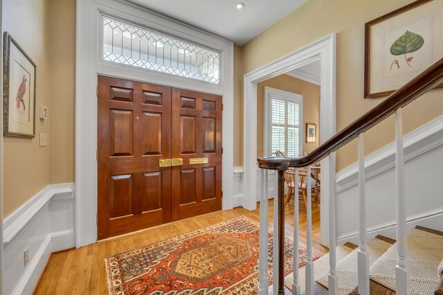100 Idle Hour Dr Unit 8, Lexington, KY 40502 - foyer entrance with stairs, light wood finished floors, wainscoting, and a decorative wall