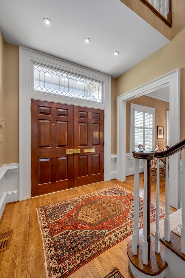 100 Idle Hour Dr Unit 8, Lexington, KY 40502 - foyer entrance with wainscoting, light wood finished floors, recessed lighting, stairs, and a decorative wall