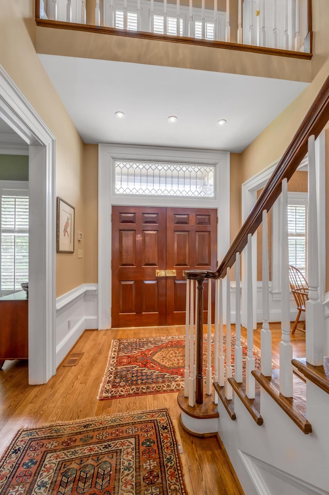 100 Idle Hour Dr Unit 8, Lexington, KY 40502 - foyer entrance featuring light wood finished floors, stairs, and wainscoting