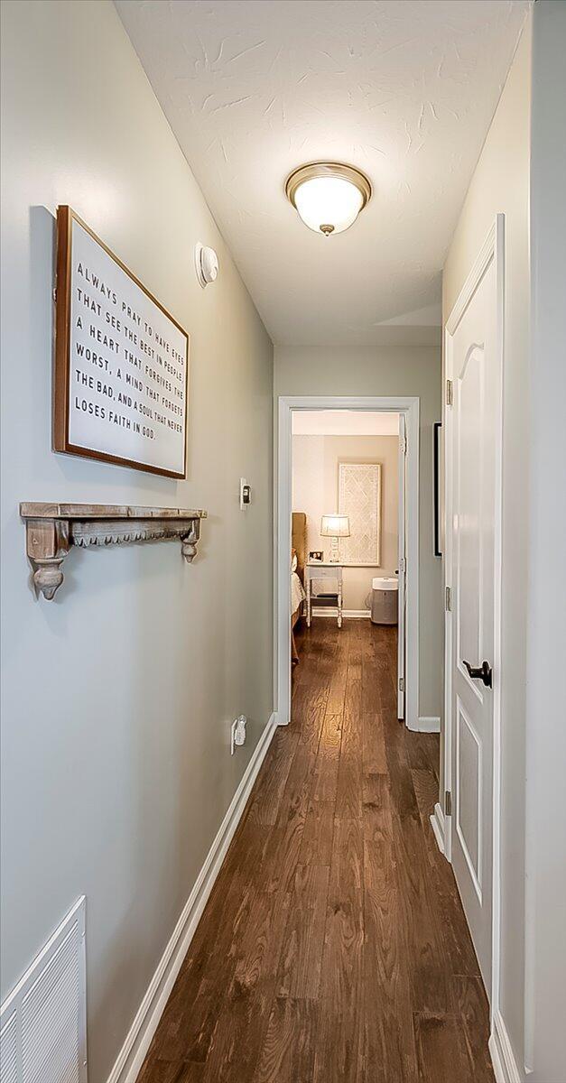 1202 Equestrian Way, Frankfort, KY 40601 - hallway with dark wood-style floors and baseboards