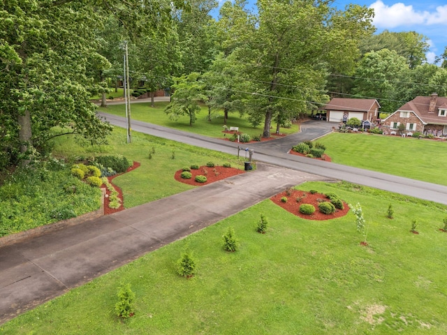 137 Indian Cave Subdivision, Monticello, KY 42633 - view of property's community with driveway, a lawn, and a garage
