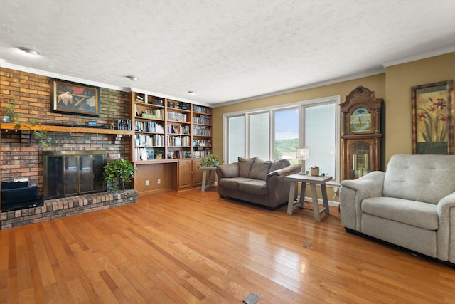 137 Indian Cave Subdivision, Monticello, KY 42633 - living room with wood-type flooring, a textured ceiling, crown molding, and a fireplace