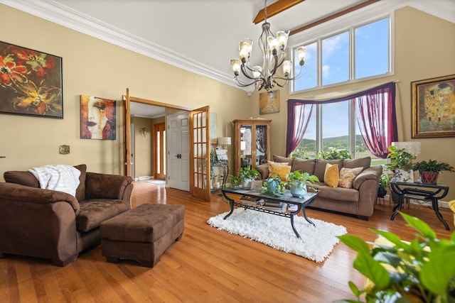 137 Indian Cave Subdivision, Monticello, KY 42633 - living area featuring a chandelier, crown molding, a towering ceiling, wood finished floors, and baseboards