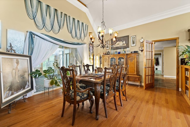 137 Indian Cave Subdivision, Monticello, KY 42633 - dining area with ornamental molding, a chandelier, wood finished floors, baseboards, and a high ceiling