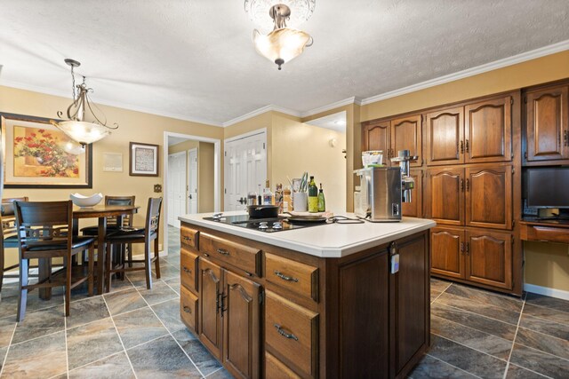 137 Indian Cave Subdivision, Monticello, KY 42633 - kitchen with dark stone finish floors, light countertops, a center island, decorative light fixtures, and crown molding