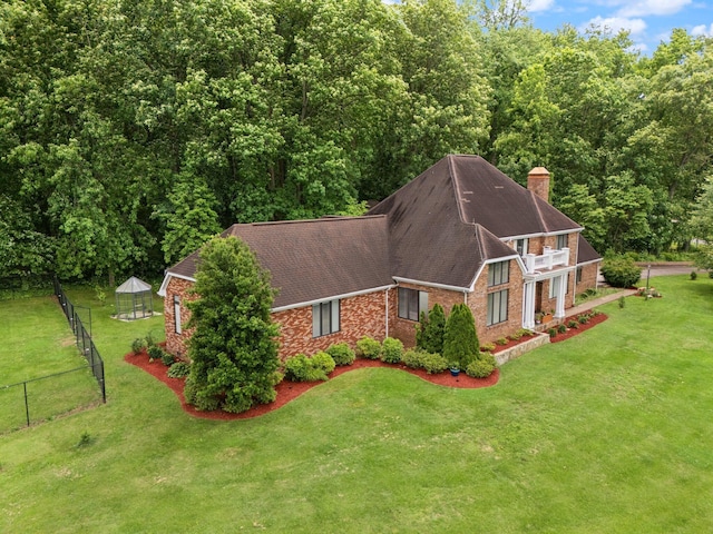 137 Indian Cave Subdivision, Monticello, KY 42633 - view of side of home featuring brick siding, a chimney, a shingled roof, and a view of trees