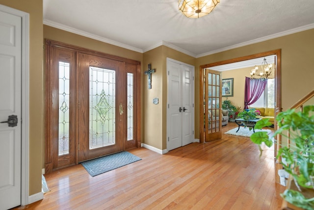 137 Indian Cave Subdivision, Monticello, KY 42633 - foyer featuring a chandelier, light wood-style flooring, crown molding, and baseboards