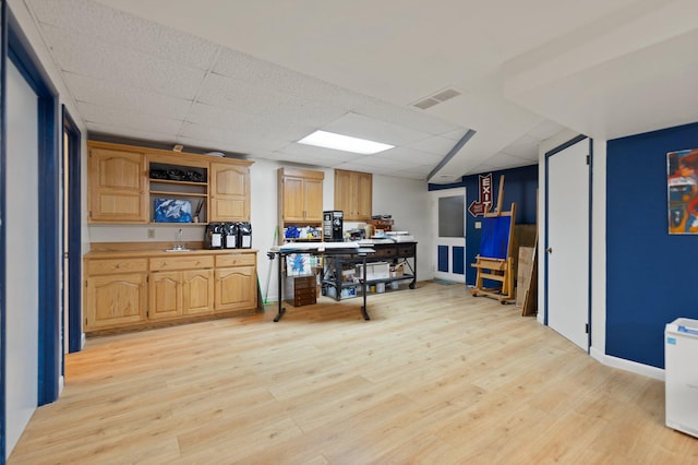 137 Indian Cave Subdivision, Monticello, KY 42633 - kitchen with a sink, light wood finished floors, a paneled ceiling, open shelves, and baseboards