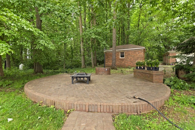 137 Indian Cave Subdivision, Monticello, KY 42633 - view of patio featuring an outdoor structure and an outdoor fire pit