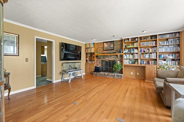 137 Indian Cave Subdivision, Monticello, KY 42633 - living area with light wood-style floors, a fireplace, ornamental molding, and baseboards