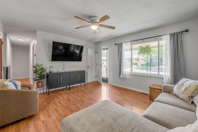 1976 Greenleaf Dr, Lexington, KY 40505 - living area featuring a ceiling fan, baseboards, wood finished floors, and a textured ceiling