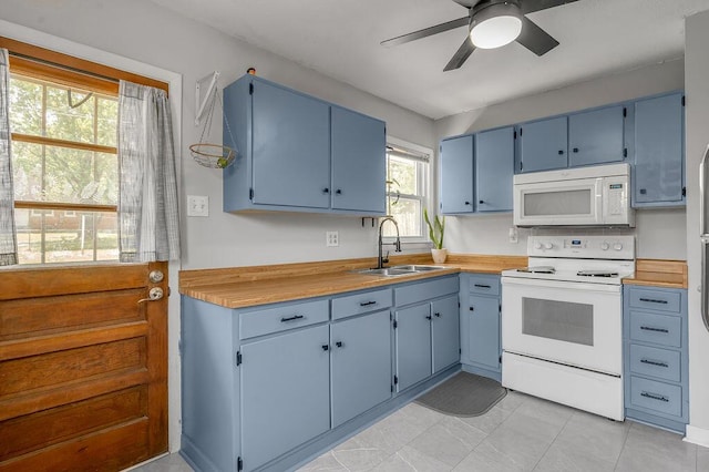 1976 Greenleaf Dr, Lexington, KY 40505 - kitchen with white appliances, a sink, blue cabinets, ceiling fan, and light countertops