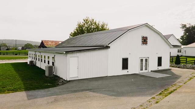 241 Old Glory Rd, Monticello, KY 42633 - view of home's exterior with a yard, metal roof, and cooling unit