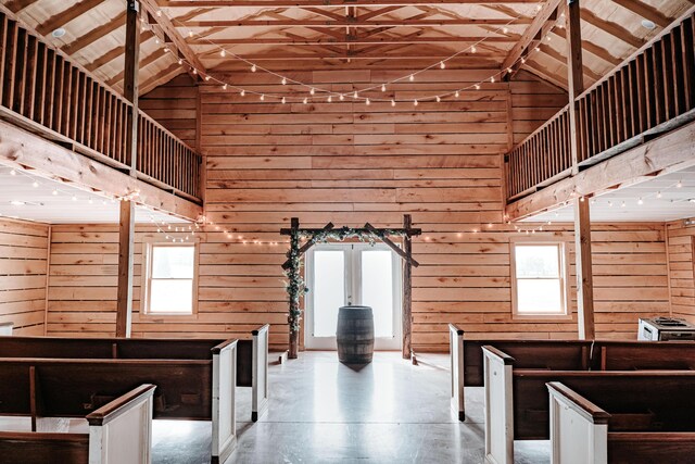 241 Old Glory Rd, Monticello, KY 42633 - stairs featuring high vaulted ceiling, wooden walls, wood finished floors, plenty of natural light, and beam ceiling