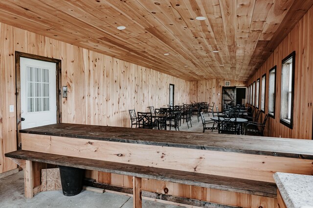 241 Old Glory Rd, Monticello, KY 42633 - dining space with wood walls and concrete flooring