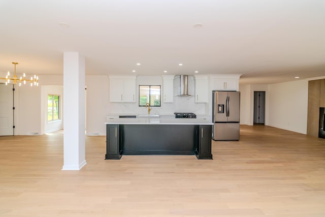 2933 Montavesta Rd, Lexington, KY 40502 - kitchen featuring stainless steel fridge with ice dispenser, wall chimney range hood, a sink, white cabinetry, and recessed lighting