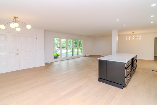 2933 Montavesta Rd, Lexington, KY 40502 - living room featuring a chandelier, light wood-style flooring, baseboards, and recessed lighting