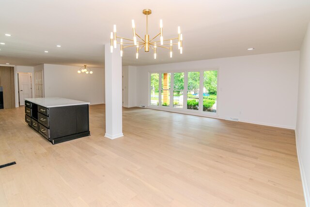 2933 Montavesta Rd, Lexington, KY 40502 - unfurnished living room featuring a chandelier, light wood-type flooring, recessed lighting, and baseboards