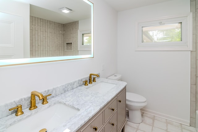 2933 Montavesta Rd, Lexington, KY 40502 - full bathroom featuring toilet, double vanity, plenty of natural light, and a shower