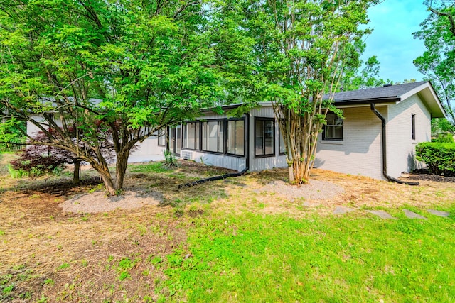2933 Montavesta Rd, Lexington, KY 40502 - back of property featuring brick siding and a sunroom