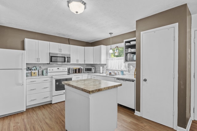 3744 Appian Way, Lexington, KY 40517 - kitchen featuring white appliances, white cabinets, light wood-style floors, a textured ceiling, and backsplash