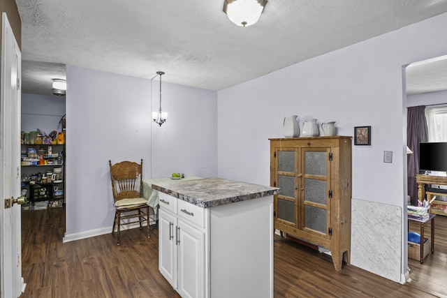 3744 Appian Way, Lexington, KY 40517 - kitchen featuring dark wood-style floors, white cabinetry, a textured ceiling, decorative light fixtures, and a center island