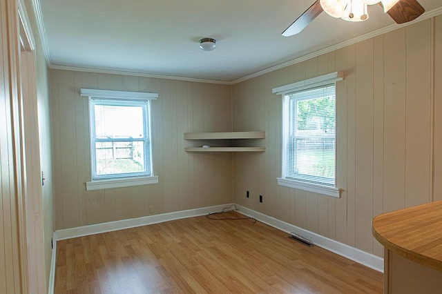 135 Rolling Acres Dr, Frankfort, KY 40601 - empty room featuring light wood-style flooring, baseboards, healthy amount of natural light, and crown molding