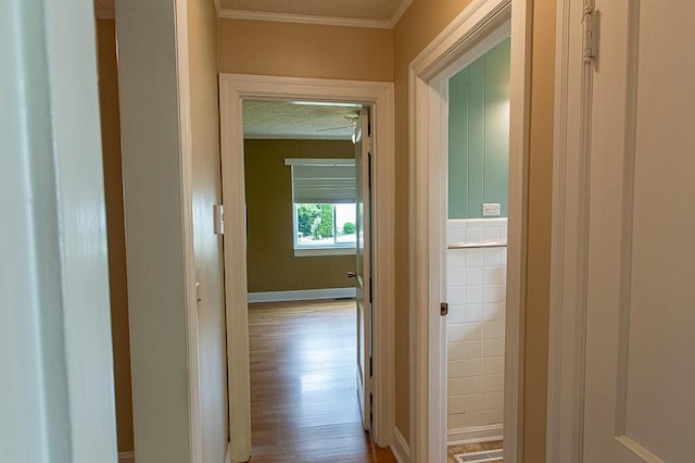 135 Rolling Acres Dr, Frankfort, KY 40601 - hallway featuring crown molding, a textured ceiling, wood finished floors, and baseboards