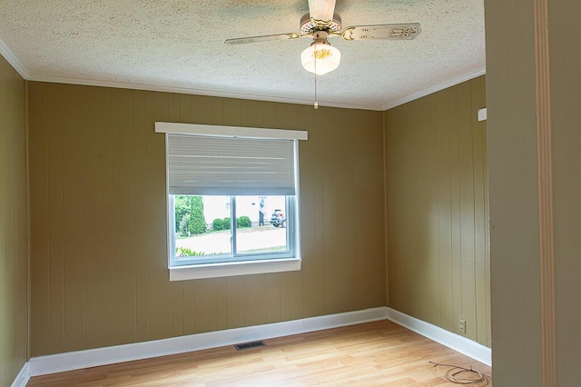 135 Rolling Acres Dr, Frankfort, KY 40601 - spare room featuring light wood-style floors, a textured ceiling, crown molding, baseboards, and ceiling fan