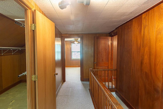 135 Rolling Acres Dr, Frankfort, KY 40601 - corridor featuring an upstairs landing, wooden walls, and baseboards