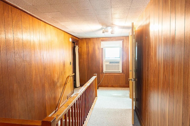 135 Rolling Acres Dr, Frankfort, KY 40601 - corridor with cooling unit, wood walls, carpet floors, and an upstairs landing