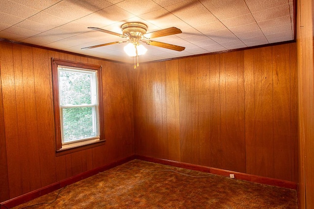 135 Rolling Acres Dr, Frankfort, KY 40601 - spare room featuring carpet floors, wood walls, and ceiling fan