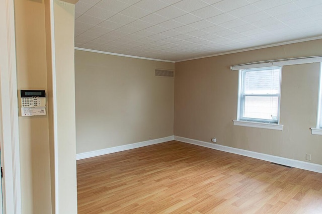 135 Rolling Acres Dr, Frankfort, KY 40601 - spare room featuring crown molding, light wood-style flooring, and baseboards