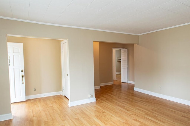 135 Rolling Acres Dr, Frankfort, KY 40601 - unfurnished room featuring light wood-style floors, ornamental molding, and baseboards