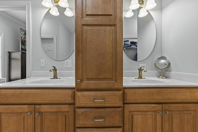 594 Earlymeade Dr, Winchester, KY 40391 - bathroom featuring double vanity, a chandelier, and ornamental molding
