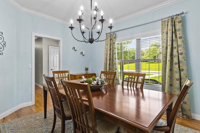 594 Earlymeade Dr, Winchester, KY 40391 - dining space featuring crown molding, a chandelier, light wood-style floors, and baseboards