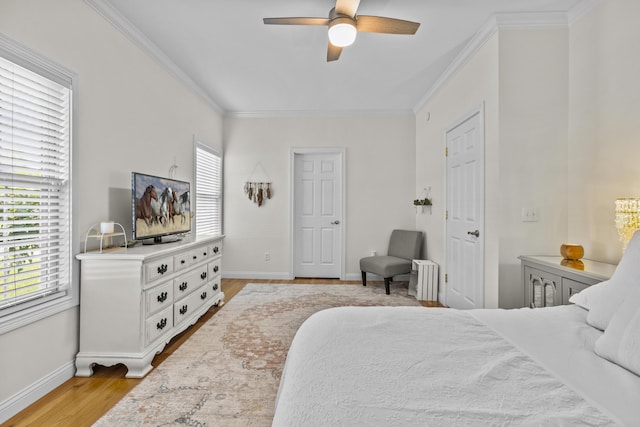 594 Earlymeade Dr, Winchester, KY 40391 - bedroom featuring crown molding, baseboards, light wood finished floors, radiator heating unit, and ceiling fan