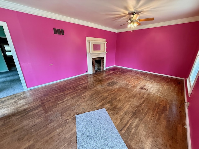 215 Bellevue Ave, Wilmore, KY 40390 - unfurnished living room with a ceiling fan, a brick fireplace, wood finished floors, crown molding, and plenty of natural light